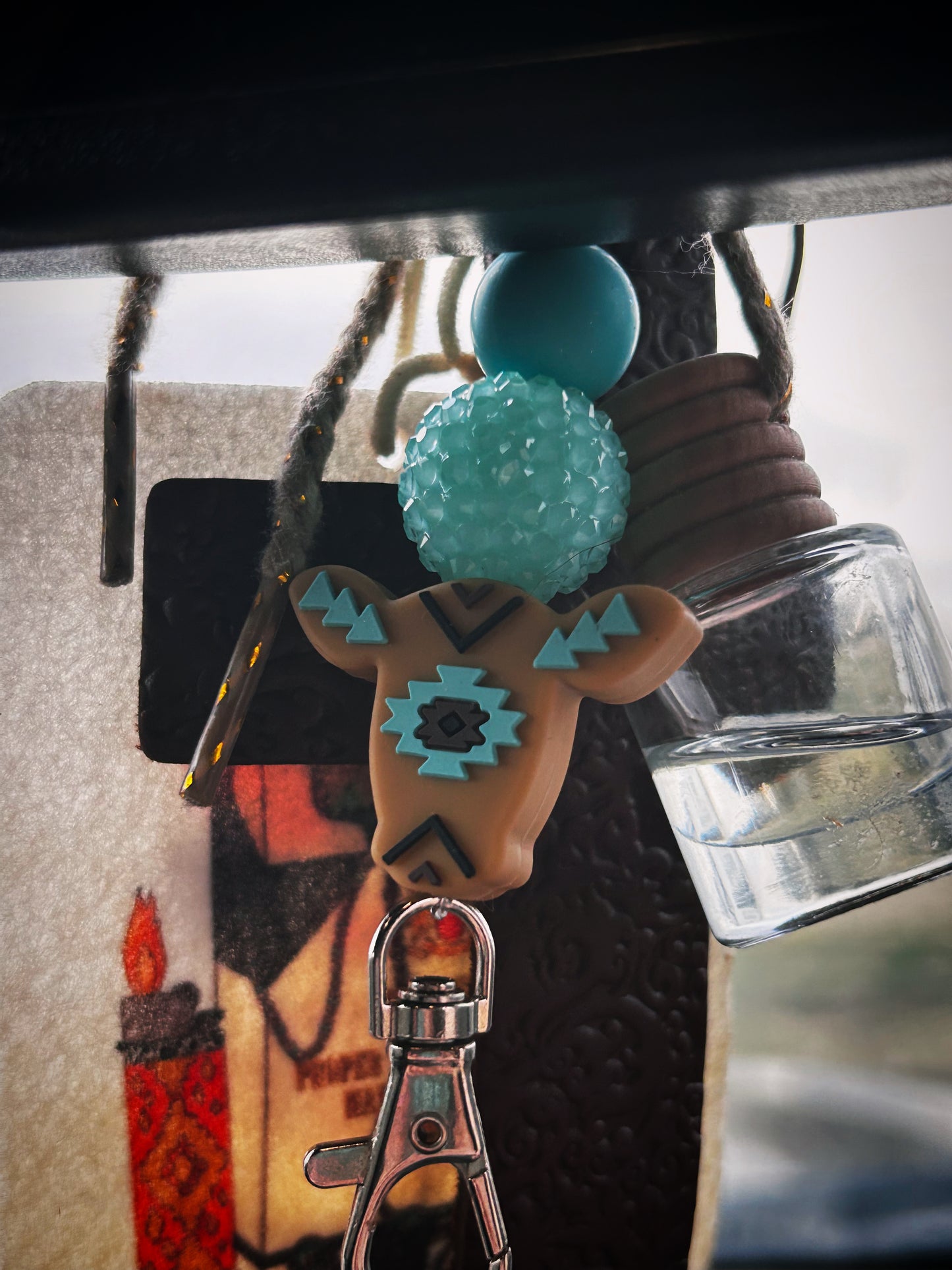 Teal and brown cow freshie hanger
